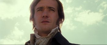 Movie still from “Pride & Prejudice” (2005), directed by Joe Wright – A person wearing a suit and tie; Close Up shot, Low angle