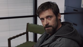 Movie still from “Prisoners” (2013), directed by Denis Villeneuve – A person with a beard wearing a jacket; Close Up shot, Over the shoulder angle
