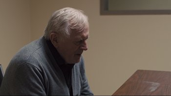 Movie still from “Prisoners” (2013), directed by Denis Villeneuve – An older man sitting at a piano looking down; Close Up shot, Over the shoulder angle