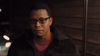 Movie still from “Prisoners” (2013), directed by Denis Villeneuve – A person wearing glasses and a jacket; Close Up shot, Low angle