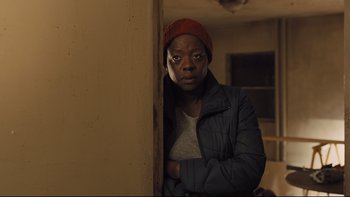 Movie still from “Prisoners” (2013), directed by Denis Villeneuve – A person leaning against a wall in a room; Close Up shot, Over the shoulder angle