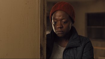 Movie still from “Prisoners” (2013), directed by Denis Villeneuve – A woman wearing a red hat and a black jacket; Close Up shot, Over the shoulder angle