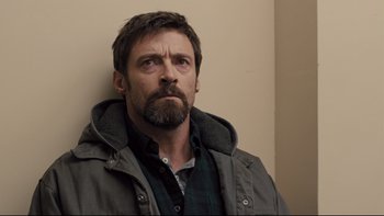 Movie still from “Prisoners” (2013), directed by Denis Villeneuve – A person with a beard wearing a jacket; Close Up shot, Low angle