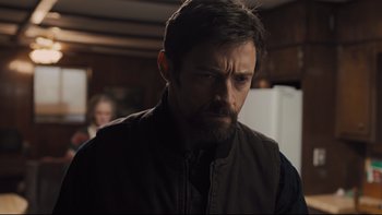 Movie still from “Prisoners” (2013), directed by Denis Villeneuve – A person with a beard wearing a vest; Close Up shot, Over the shoulder angle