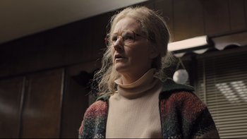 Movie still from “Prisoners” (2013), directed by Denis Villeneuve – An older woman wearing glasses and a sweater; Close Up shot, Low angle