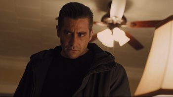 Movie still from “Prisoners” (2013), directed by Denis Villeneuve – A person wearing a black jacket; Close Up shot, Over the shoulder angle