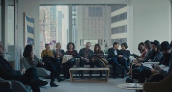 Movie still from “Private Life” (2018), directed by Tamara Jenkins – A group of people sitting on a couch in front of a window; Wide shot, High angle