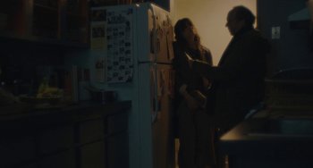 Movie still from “Private Life” (2018), directed by Tamara Jenkins – Two people standing in front of an open refrigerator; Medium shot, Over the shoulder angle