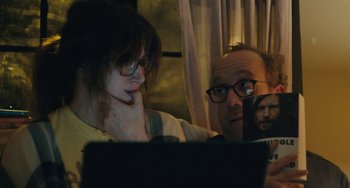 Movie still from “Private Life” (2018), directed by Tamara Jenkins – A man and a woman looking at a computer screen; Close Up shot, Over the shoulder angle
