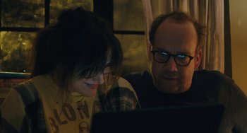 Movie still from “Private Life” (2018), directed by Tamara Jenkins – A man and a woman looking at a computer screen; Close Up shot, Over the shoulder angle