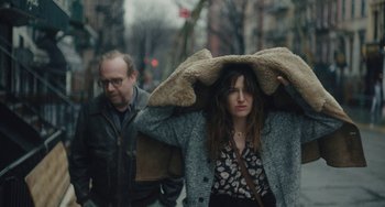 Movie still from “Private Life” (2018), directed by Tamara Jenkins – A man and a woman walking down a street; Medium shot, Over the shoulder angle