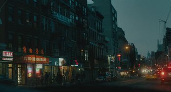 Movie still from “Private Life” (2018), directed by Tamara Jenkins – A city street at night lit by street lights; Extreme Wide shot, Low angle