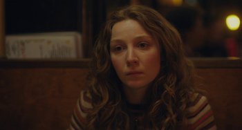 Movie still from “Private Life” (2018), directed by Tamara Jenkins – A person with curly hair; Close Up shot, Over the shoulder angle