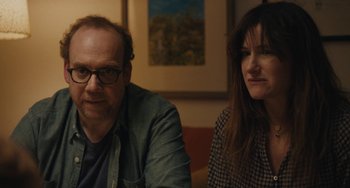 Movie still from “Private Life” (2018), directed by Tamara Jenkins – A man and a woman sitting next to each other in a room; Close Up shot, Over the shoulder angle
