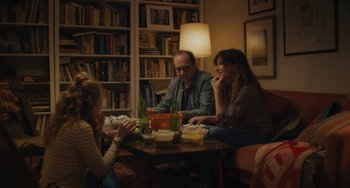 Movie still from “Private Life” (2018), directed by Tamara Jenkins – A group of people sitting around a table eating food; Medium shot, Over the shoulder angle