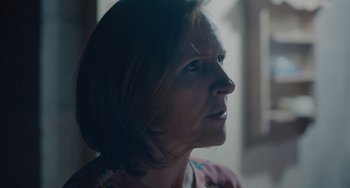 Movie still from “Private Life” (2018), directed by Tamara Jenkins – A woman's face looking up; Close Up shot, Over the shoulder angle