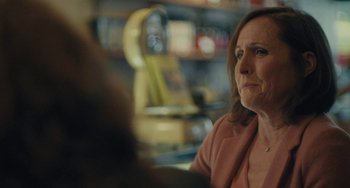 Movie still from “Private Life” (2018), directed by Tamara Jenkins – A person sitting at a table; Close Up shot, Over the shoulder angle