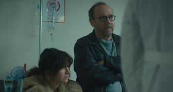Movie still from “Private Life” (2018), directed by Tamara Jenkins – A man and a woman standing next to each other in a room; Close Up shot, Over the shoulder angle