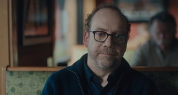 Movie still from “Private Life” (2018), directed by Tamara Jenkins – A person wearing glasses and a sweater; Close Up shot, Over the shoulder angle