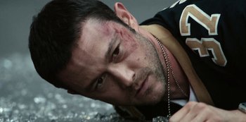 Movie still from “Project Power” (2020), directed by Henry Joost – A person laying on the ground; Close Up shot, High angle