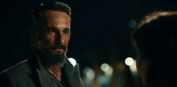 Movie still from “Project Power” (2020), directed by Henry Joost – A man with a long beard and a mustache; Close Up shot, Over the shoulder angle