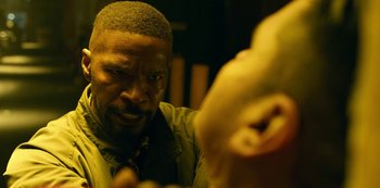 Movie still from “Project Power” (2020), directed by Henry Joost – A person looking at a mirror; Close Up shot, Over the shoulder angle