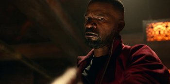 Movie still from “Project Power” (2020), directed by Henry Joost – A person wearing a jacket; Close Up shot, Over the shoulder angle