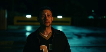 Movie still from “Project Power” (2020), directed by Henry Joost – A man standing in the middle of a street; Close Up shot, High angle