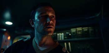 Movie still from “Project Power” (2020), directed by Henry Joost – A person wearing a black shirt; Close Up shot, Low angle