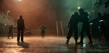 Movie still from “Project Power” (2020), directed by Henry Joost – A group of people standing in the rain; Extreme Wide shot, Low angle