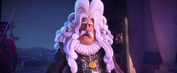 Movie still from “Puss in Boots: The Last Wish” (2022), directed by Januel Mercado – A cartoon character is dressed in a wig and beard; Close Up shot, Over the shoulder angle