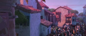 Movie still from “Puss in Boots: The Last Wish” (2022), directed by Januel Mercado – A painting of people gathered outside a building; Extreme Wide shot, Low angle