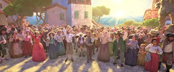 Movie still from “Puss in Boots: The Last Wish” (2022), directed by Januel Mercado – A crowd of people standing around a cow; Wide shot, High angle