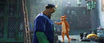 Movie still from “Puss in Boots: The Last Wish” (2022), directed by Januel Mercado – A man and a cat are standing next to each other; Medium shot, Over the shoulder angle