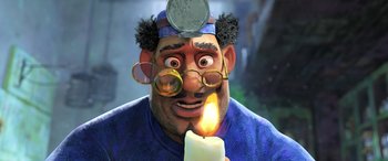 Movie still from “Puss in Boots: The Last Wish” (2022), directed by Januel Mercado – An animated man with a candle in his hand; Medium shot, Low angle