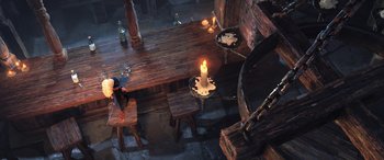 Movie still from “Puss in Boots: The Last Wish” (2022), directed by Januel Mercado – An overhead view of a table with a lit candle on it; Extreme Wide shot, High angle