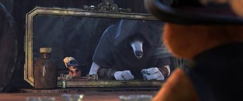 Movie still from “Puss in Boots: The Last Wish” (2022), directed by Januel Mercado – An image of a bear in the mirror; Medium shot, Over the shoulder angle