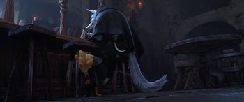 Movie still from “Puss in Boots: The Last Wish” (2022), directed by Januel Mercado – A person in a yellow dress and a white and black animal; Wide shot, Over the shoulder angle