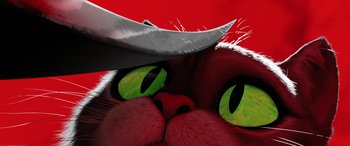 Movie still from “Puss in Boots: The Last Wish” (2022), directed by Januel Mercado – A cat's eyes with a knife in it's mouth; Extreme Close Up shot, Low angle