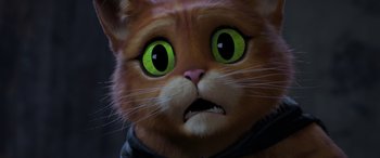 Movie still from “Puss in Boots: The Last Wish” (2022), directed by Januel Mercado – The face of a cat with green eyes; Close Up shot, High angle