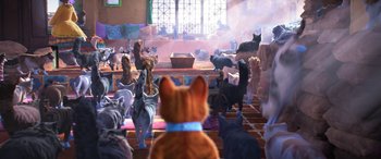 Movie still from “Puss in Boots: The Last Wish” (2022), directed by Januel Mercado – A group of cats are gathered together in a room; Wide shot, High angle