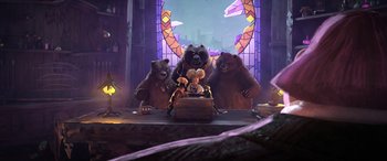 Movie still from “Puss in Boots: The Last Wish” (2022), directed by Januel Mercado – A group of bears sitting on top of a wooden table; Wide shot, Low angle