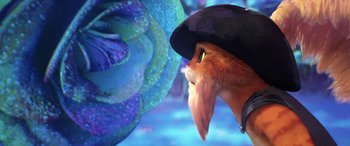 Movie still from “Puss in Boots: The Last Wish” (2022), directed by Januel Mercado – A person wearing a hat; Close Up shot, Over the shoulder angle