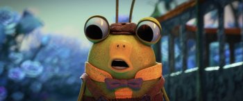 Movie still from “Puss in Boots: The Last Wish” (2022), directed by Januel Mercado – A cartoon bug with a bow tie around it's neck; Close Up shot, High angle