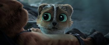 Movie still from “Puss in Boots: The Last Wish” (2022), directed by Januel Mercado – A stuffed animal cat with big eyes and long whiskers; Close Up shot, High angle