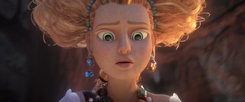 Movie still from “Puss in Boots: The Last Wish” (2022), directed by Januel Mercado – A girl's face with green eyes; Close Up shot, Low angle