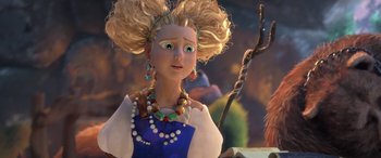 Movie still from “Puss in Boots: The Last Wish” (2022), directed by Januel Mercado – A woman with blonde curly hair wearing a blue dress; Close Up shot, Over the shoulder angle