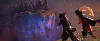 Movie still from “Puss in Boots: The Last Wish” (2022), directed by Januel Mercado – A cat is standing in front of an island; Wide shot, High angle