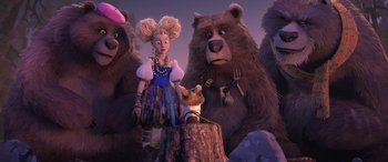 Movie still from “Puss in Boots: The Last Wish” (2022), directed by Januel Mercado – A group of people standing next to each other with bears; Wide shot, Low angle