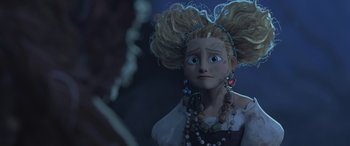 Movie still from “Puss in Boots: The Last Wish” (2022), directed by Januel Mercado – A doll with a lot of beads around her neck; Close Up shot, Over the shoulder angle